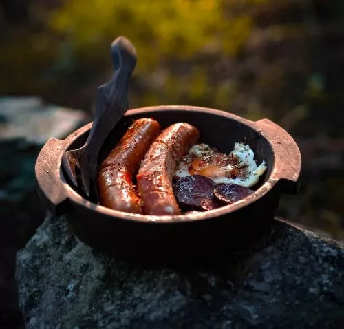 Sausage and Eggs over campfire. Understanding how to nourish your body during a time of crisis is crucial.