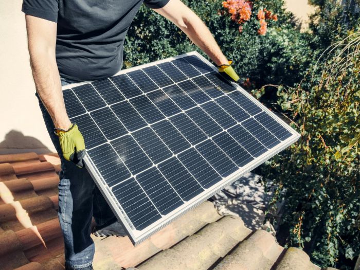 Cooking without Power: Emergency Heat Sources for Preppers. Building a DIY Emergency Solar Power System Photo by Kindel Media: https://www.pexels.com/photo/a-person-in-black-shirt-holding-a-solar-panel-while-standing-on-the-roof-9875441/